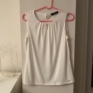 White sleeveless gold hardware top